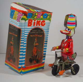 Vintage Tin Litho Wind Up Duck On Bicycle Made In Beijing -