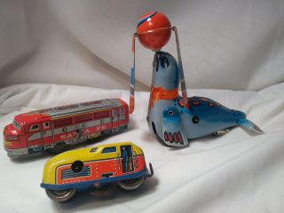 3 Antique Tin Wind Up Toys Seal Dante Fe Locomotive Japan China Western Germany