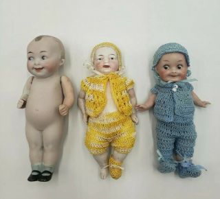 (3) Bisque Dolls 5.  25 " Hand Painted Unmarked 2 W/crochet Clothes 1w/frozen Legs