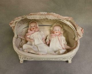 Two Antique All Bisque 6 Inch Baby Dolls Hooded Wicker Cradle Lace Ribbon Trim