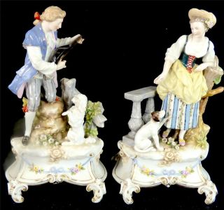 N671 Pair Antique Karl Ens Porcelain Figurines Man & Lady Each With Dogs