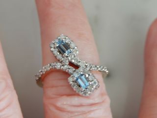 A 9 Ct Gold Twist Set Blue Topaz And Diamond Ring