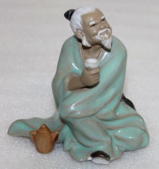 A Chinese Shiwan Glazed Pottery Ancient Old Man Drinking Wine Statue