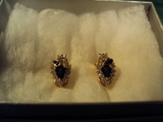 A Vintage 14k Gold Diamond And Sapphire Earrings.