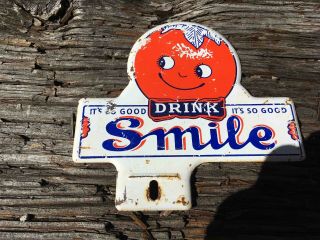 Vintage Drink Smile Orange Soda Metal Advertising License Plate Topper Sign