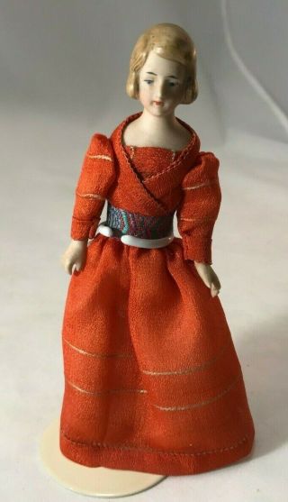 Antique German Bisque Girl With Orange Dress With Sash