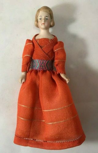 Antique German Bisque Girl with Orange Dress with Sash 2