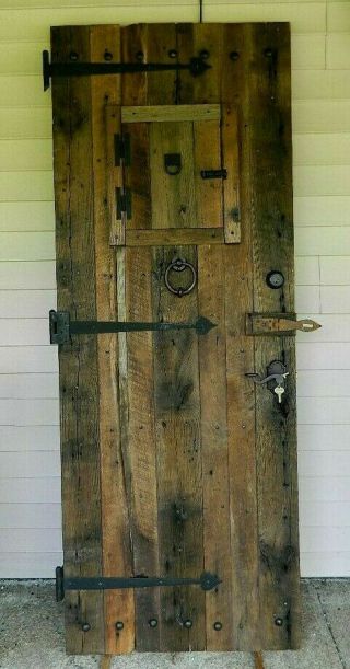 Vintage Rustic Entry Door Fashioned After A Salvaged And Reclaimed Barn Door
