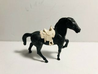 Stuart Vintage Standing Horse With White Saddle In Black Color.