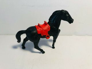 Stuart Vintage Standing Horse With Red Saddle In Black Color.
