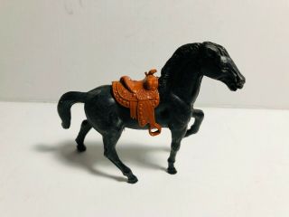Stuart Vintage Standing Horse With Brown Saddle In Black Color.