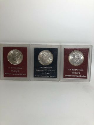 3 Paramount International Coin Corp Silver Dollars Including A Rare Redfield