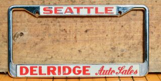 Vtg 70s Embossed Metal License Dealer Plate Frame Delridge Auto Seattle Datsun
