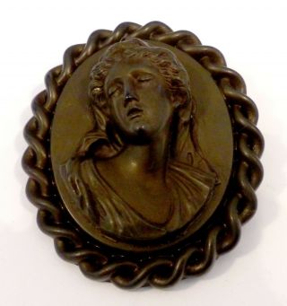 A Large Victorian Vulcanite Cameo Brooch With Rope Edging