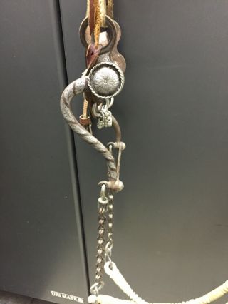 Vintage silver bit,  with headstall,  rein chains and rawhide reins and romel. 7