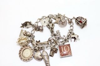 A Vintage C1965 Sterling Silver 925 Charm Bracelet - 17 Charms 12756e