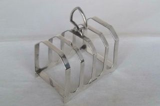 A Large & Heavy Solid Silver Four Slice Toast Rack Sheffield 1931 109 Grams.