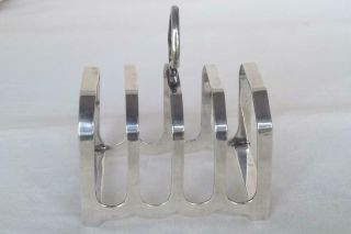 A LARGE & HEAVY SOLID SILVER FOUR SLICE TOAST RACK SHEFFIELD 1931 109 grams. 4