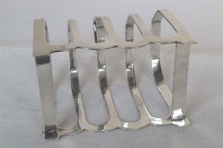 A LARGE & HEAVY SOLID SILVER FOUR SLICE TOAST RACK SHEFFIELD 1931 109 grams. 7