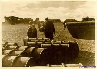 Press Photo: Precious Cargo Luftwaffe Ju - 52 Transports Off Load Petrol Drums