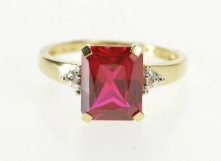 10k Syn.  Ruby Diamond Accent Three Stone Ring Size 7.  25 Yellow Gold 72