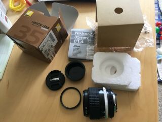 Nikon NIKKOR 35mm f/1.  4 Ai - S Lens.  RARELY,  BOX,  2 CAPS,  52mm Filter 11