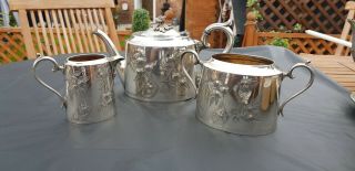 An Antique Silver Plated Tea Set With Respoused Patterns By James Deakin & Sons.
