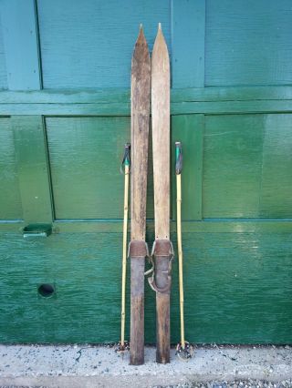 Antique Patina Skis 60 " Long With Metal Bindings And Old Bamboo Poles