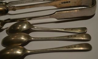 128 GRAMS OF SCRAP SILVER SUGAR TONGS,  SPOONS.  BUTTER KNIFE.  ALL HALLMARKED. 8