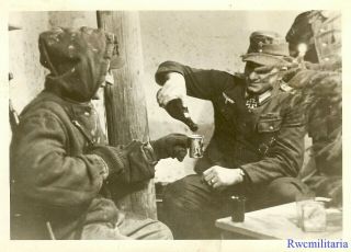 Press Photo: Rare Wehrmacht Officer W/ Knights Cross Award Drinks W/ Troops