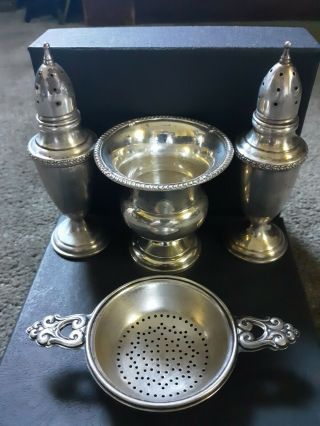 Sterling Silver Tea Strainer,  Salt And Pepper Shakers And Vase.  Total Weight Is.