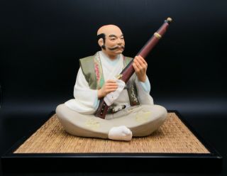 Vintage Japanese Hakata Urasaki Doll Ceramic Figurine Man Cleaning His Gun