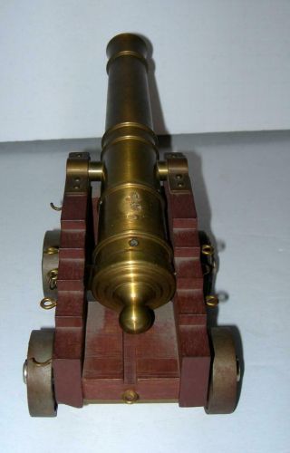 VINTAGE ORNATE BRASS AND WOOD CANON.  11 