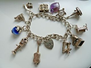 Good Vintage Solid Silver Padlock Charm Bracelet With 12 Charms Some Open 56.  1g