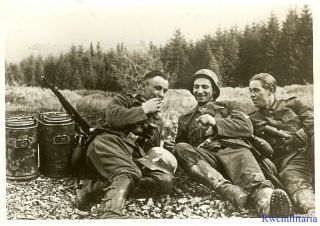 Press Photo: Break Time Wehrmacht Troops W/ Cigarettes By Food Canisters