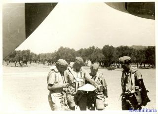 Press Photo: Mission Plan Luftwaffe Afrika Korps Bomber Crew Checking Maps