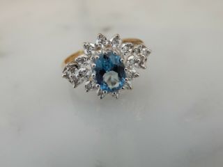 A Fabulous 9 Ct Gold Blue Zircon And Diamond Cluster Ring
