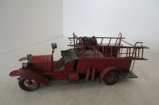 Vintage Model Of An Antique Fire Truck Made Of Cast Metal And Very Detailed