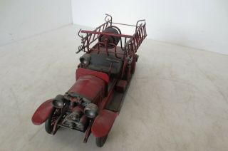 Vintage Model of an Antique Fire Truck made of cast metal and very detailed 2