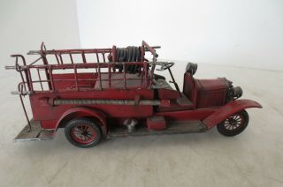 Vintage Model of an Antique Fire Truck made of cast metal and very detailed 4