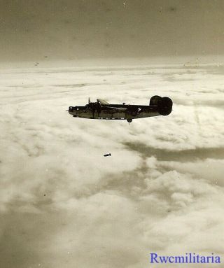 Org.  Photo: Aerial View B - 24 Bomber Dropping Bombs Over Target On Mission