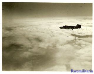 Org.  Photo: Aerial View B - 24 Bomber Dropping Bombs Over Target on Mission 2