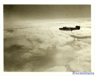 Org.  Photo: Aerial View B - 24 Bomber Dropping Bombs on Target 2