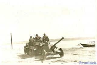 Press Photo: Best German Troops In Sdkfz Halftrack Towing Pak 38 5cm Gun; 1941