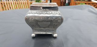 An Antique Victorian Silver Plated Tea Caddy With Engraved Patterns.