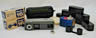 Vintage Minolta - 16 Film Camera With Empty Catridges,  Lens Filters,  Case,  Battery