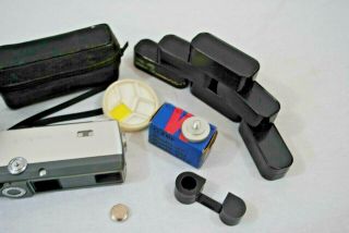 Vintage Minolta - 16 Film Camera with empty catridges,  Lens filters,  Case,  Battery 2