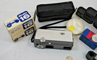 Vintage Minolta - 16 Film Camera with empty catridges,  Lens filters,  Case,  Battery 3