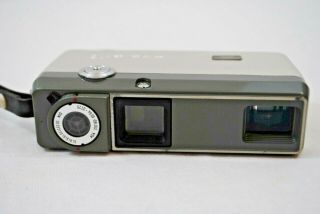 Vintage Minolta - 16 Film Camera with empty catridges,  Lens filters,  Case,  Battery 8