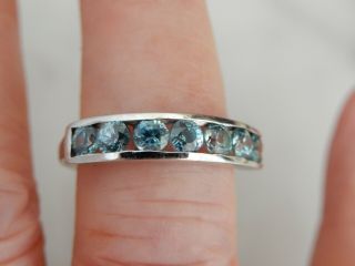 A 9 Ct White Gold Channel Set Blue Zircon Ring